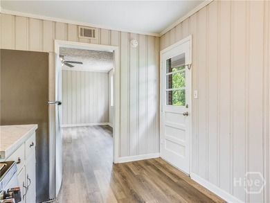 Solid and low-maintenance, this all-brick triplex sits in Garden - photo 5