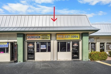 Bright, open showroom with newly applied SunDek finished floors - photo 2