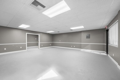 Bright, open showroom with newly applied SunDek finished floors - photo 4