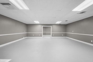Bright, open showroom with newly applied SunDek finished floors - photo 5