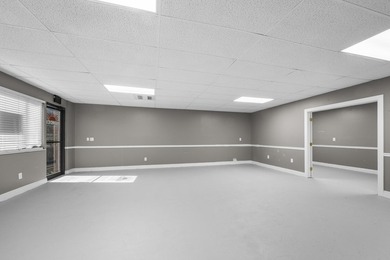 Bright, open showroom with newly applied SunDek finished floors - photo 6