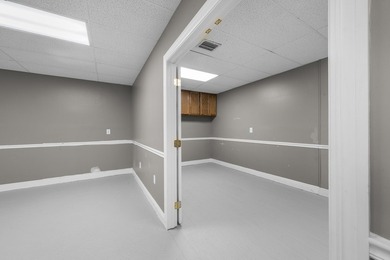 Bright, open showroom with newly applied SunDek finished floors - photo 7