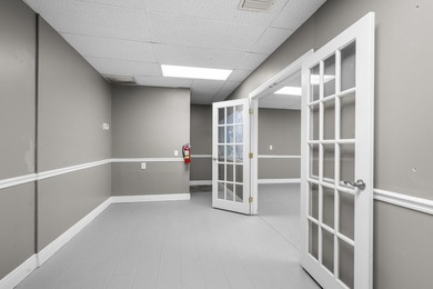 Bright, open showroom with newly applied SunDek finished floors - photo 9