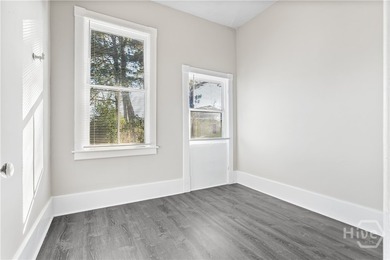 This well-maintained four-unit property offers investors a rare - photo 6