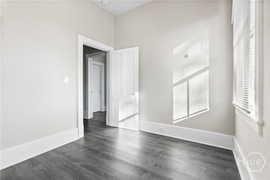 This well-maintained four-unit property offers investors a rare - photo 7