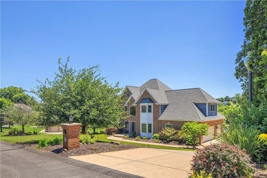 The stately two story residence has a 10 out of 10 view with - photo 3