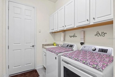 Tucked behind the gates of Harbor West, this exceptional - photo 20