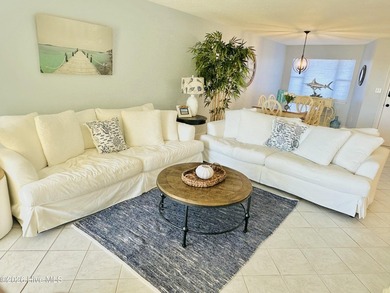 Experience oceanfront living in this beautifully appointed