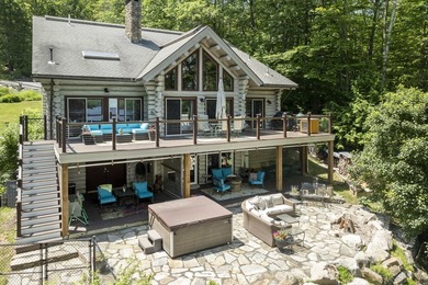 Experience exceptional lakeside living in this custom-built log - photo 11