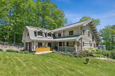 Experience exceptional lakeside living in this custom-built log - photo 13