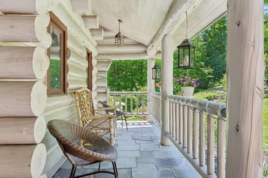 Experience exceptional lakeside living in this custom-built log - photo 14