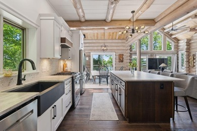 Experience exceptional lakeside living in this custom-built log - photo 16