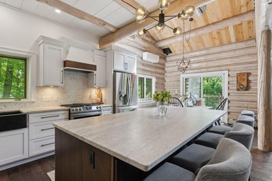 Experience exceptional lakeside living in this custom-built log - photo 18