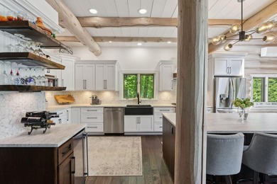 Experience exceptional lakeside living in this custom-built log - photo 19