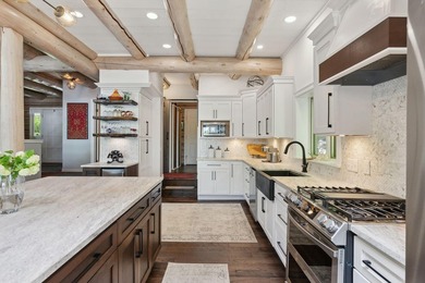 Experience exceptional lakeside living in this custom-built log - photo 20