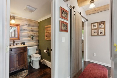 Experience exceptional lakeside living in this custom-built log - photo 30