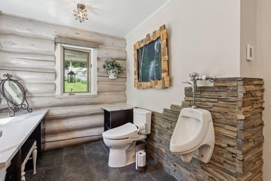 Experience exceptional lakeside living in this custom-built log - photo 38