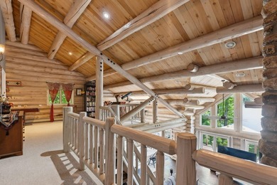 Experience exceptional lakeside living in this custom-built log - photo 46