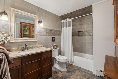 Experience exceptional lakeside living in this custom-built log - photo 49