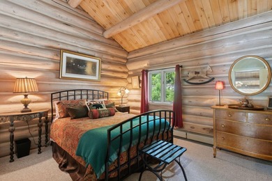 Experience exceptional lakeside living in this custom-built log - photo 50