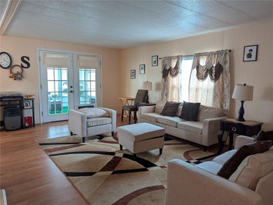 This lovely home is located in a 55+ community where you own - photo 5