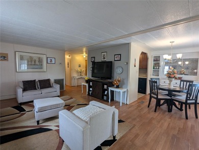 This lovely home is located in a 55+ community where you own - photo 6