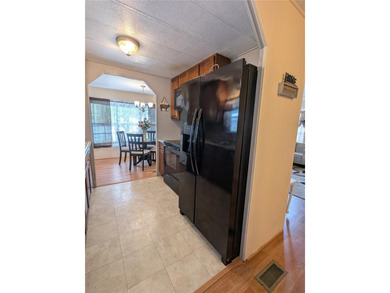 This lovely home is located in a 55+ community where you own - photo 7