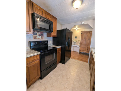 This lovely home is located in a 55+ community where you own - photo 8