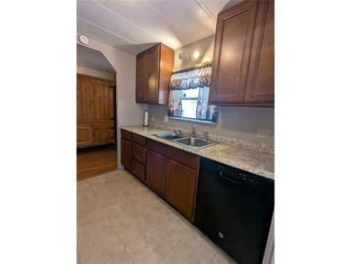 This lovely home is located in a 55+ community where you own - photo 9