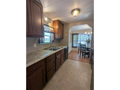 This lovely home is located in a 55+ community where you own - photo 10