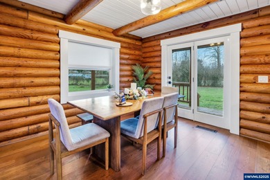Welcome to this beautifully updated log-style home on 1.5 acres