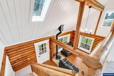Welcome to this beautifully updated log-style home on 1.5 acres