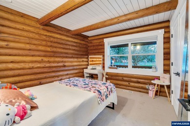 Welcome to this beautifully updated log-style home on 1.5 acres