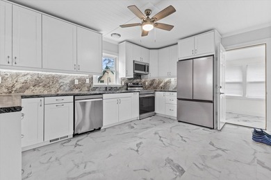 Welcome home to this beautiful Lake Geneva bungalow! Because the - photo 7