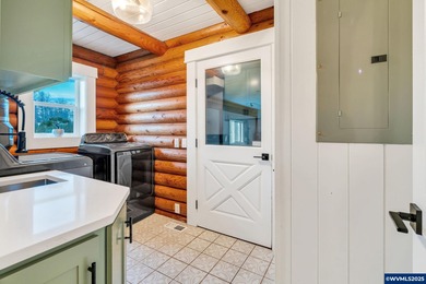 Welcome to this beautifully updated log-style home on 1.5 acres