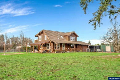 Welcome to this beautifully updated log-style home on 1.5 acres