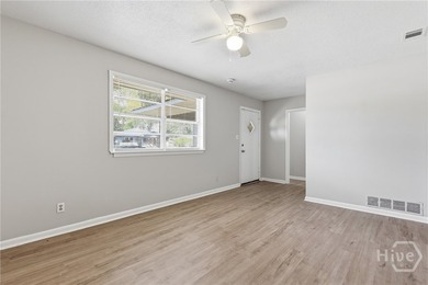 Updated, affordable, and full of potential, this all-brick ranch - photo 4