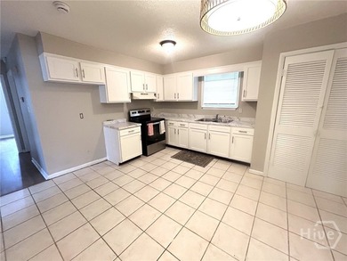 Updated, affordable, and full of potential, this all-brick ranch - photo 10