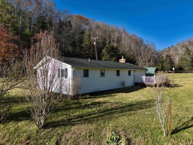 Charming 3 bedroom, one level home on over 5 ACRES WITH CREEK &