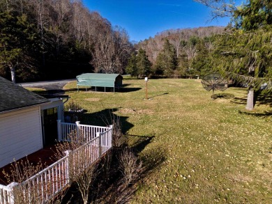 Charming 3 bedroom, one level home on over 5 ACRES WITH CREEK &