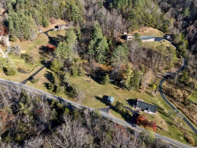 Charming 3 bedroom, one level home on over 5 ACRES WITH CREEK &