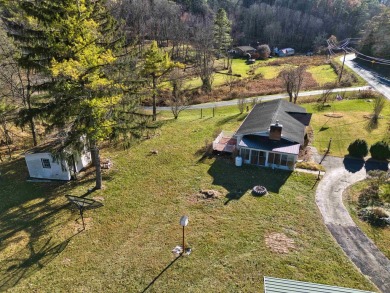 Charming 3 bedroom, one level home on over 5 ACRES WITH CREEK &