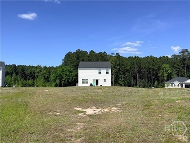 Positioned on a pond-view lot, this move-in ready 2023-built - photo 8