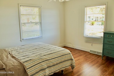 Tucked beneath a canopy of moss-draped live oaks, this home in - photo 18
