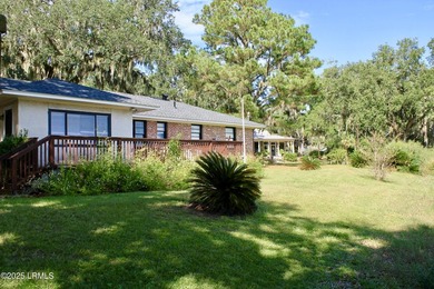 Tucked beneath a canopy of moss-draped live oaks, this home in - photo 31