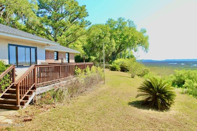 Tucked beneath a canopy of moss-draped live oaks, this home in - photo 32