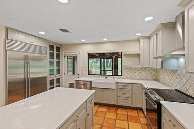 This stunning Neo-Spanish Revival home is nestled among majestic - photo 11