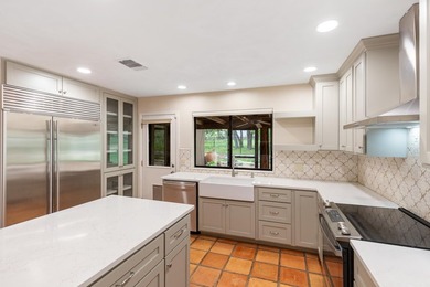 This stunning Neo-Spanish Revival home is nestled among majestic - photo 12