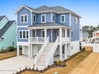 Discover coastal luxury at 367 Spicer Lake Drive, located in the
