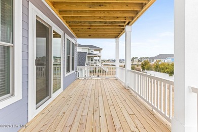 Discover coastal luxury at 367 Spicer Lake Drive, located in the